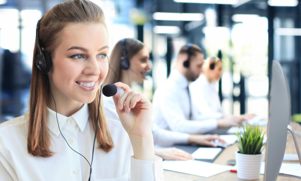 portrait-call-center-worker-accompanied-by-his-team-smiling-customer-support-operator-work