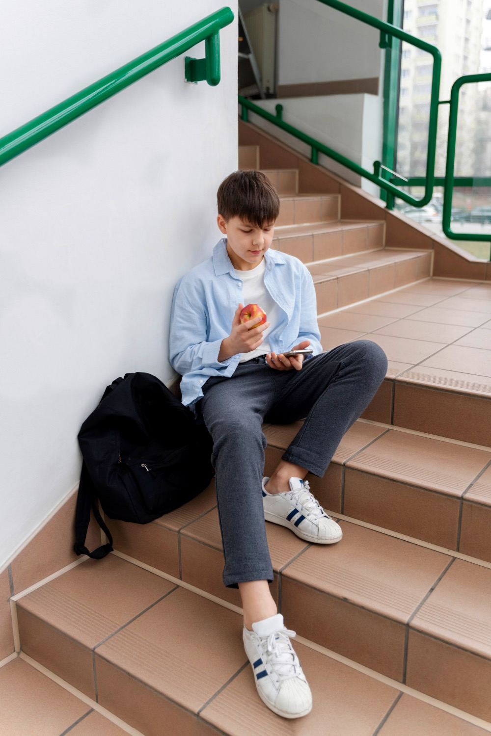 VitalPBX for K-12 School Districts | E911-Ready Phone System 1 Student on a school stairwell